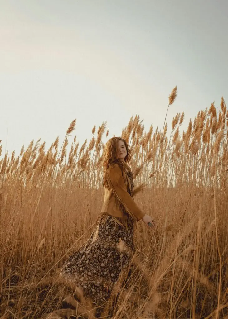 pexels-photo-11744136-11744136 A smiling woman in a floral dress enjoys a walk through a wheat field in Des Moines, Iowa.